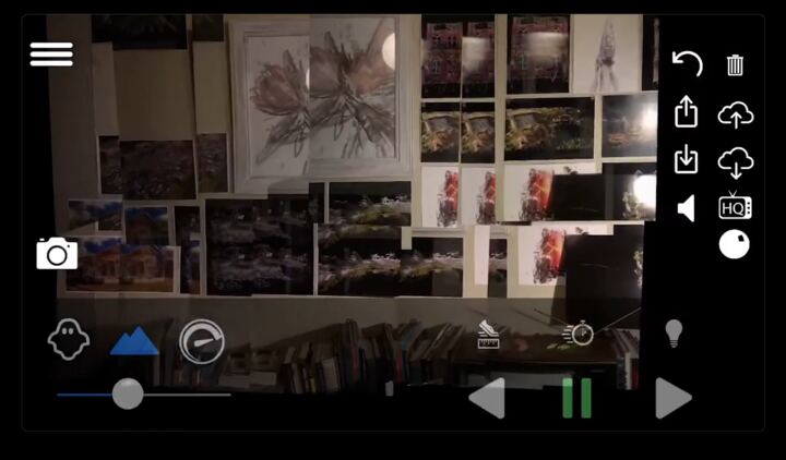 Wall of AR photographs pinned in mid-air in a study
