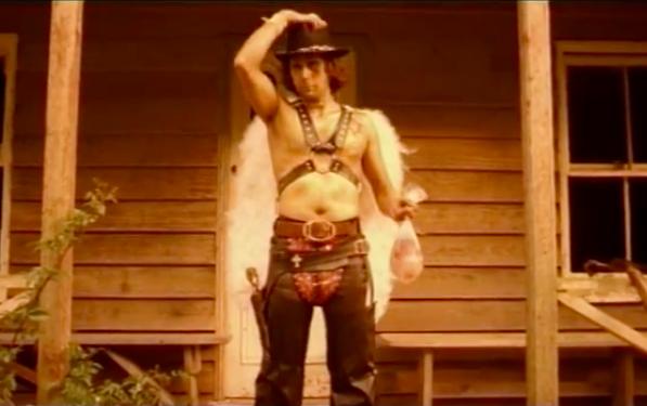 Winged cowboy on a porch — still from Little Gold Cowboy