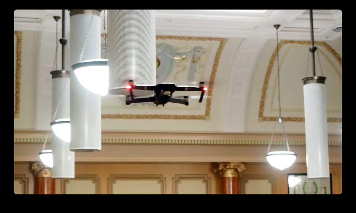 Drone flying among chandeliers inside the chamber