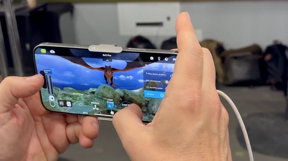 iPhone running Viz Pro with a dragon in a live AR scene